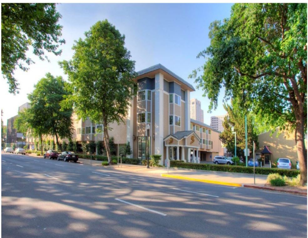 City approves purchase of downtown motel to create more housing for people experiencing homelessness