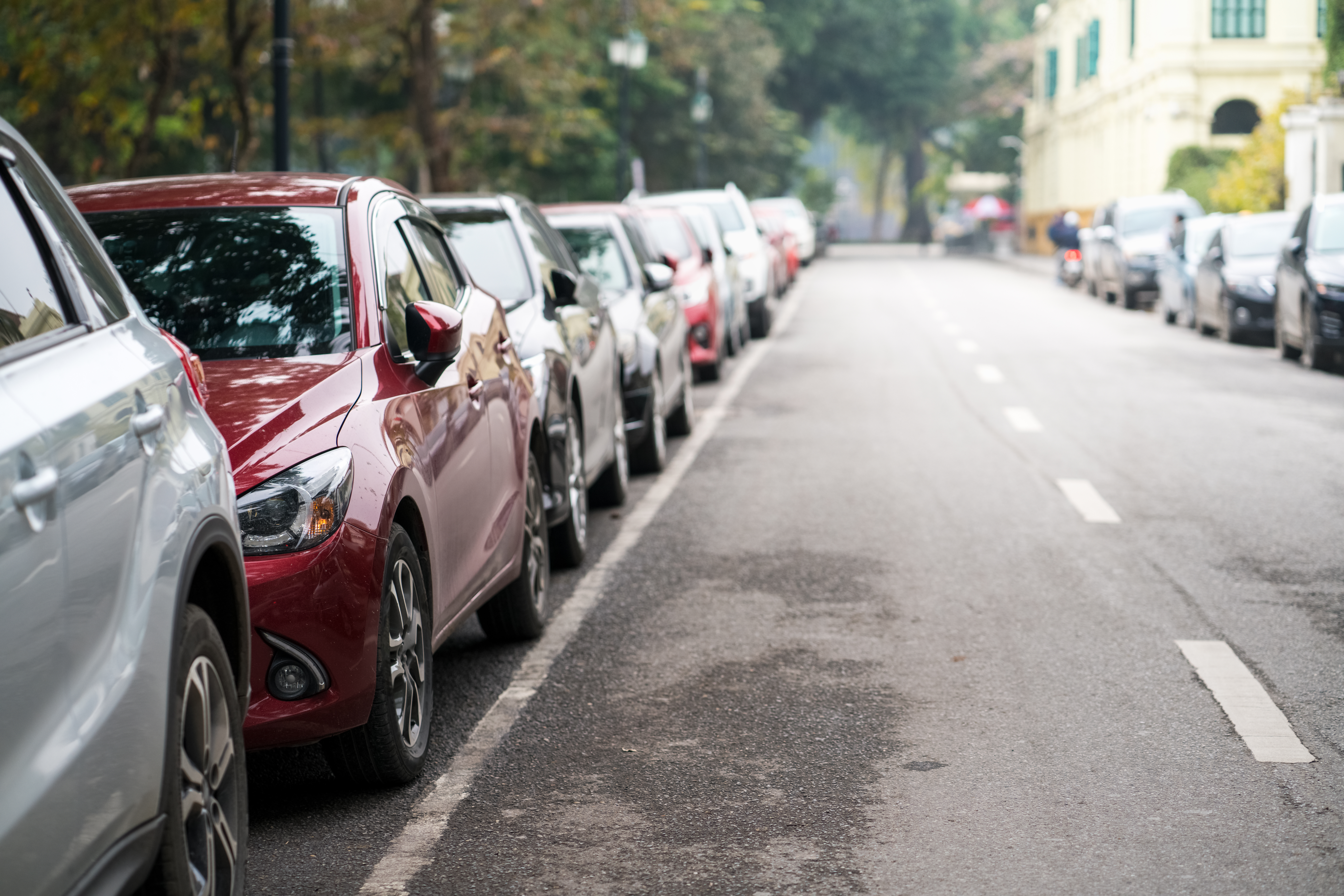 a line of parked cars on a street