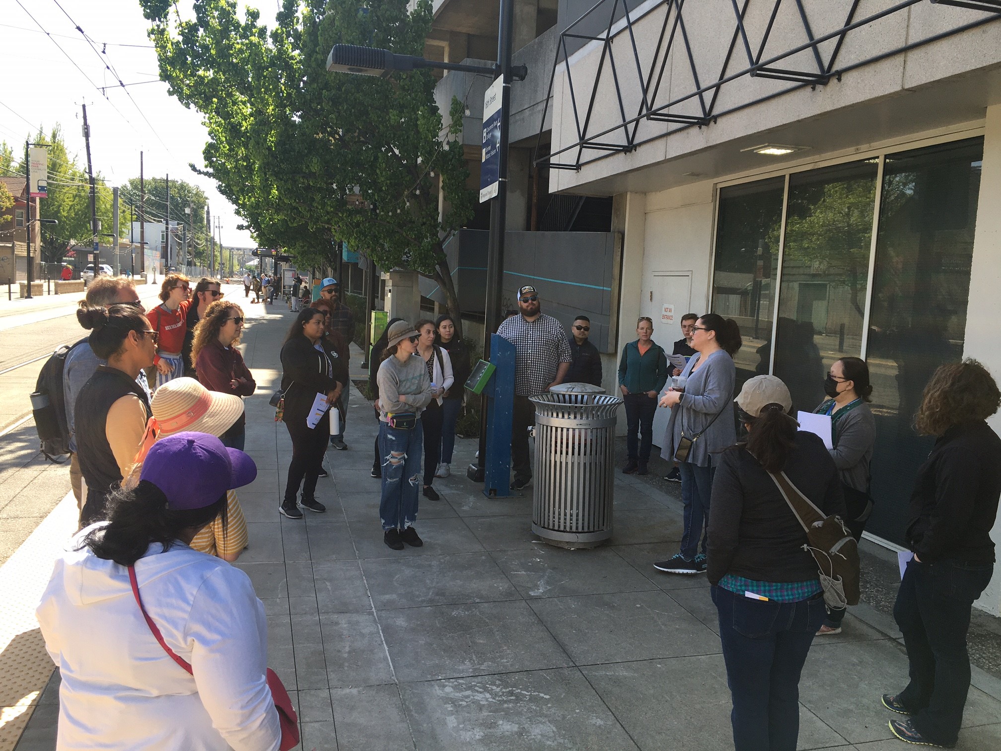 a group of about 20 people listening to a speaker in Sacramento for the planning academy